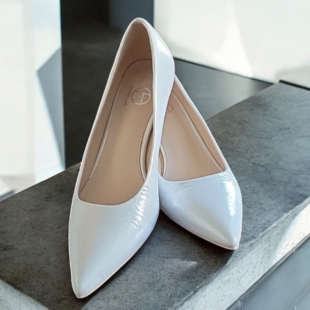 NWOT Oripalla silver pumps